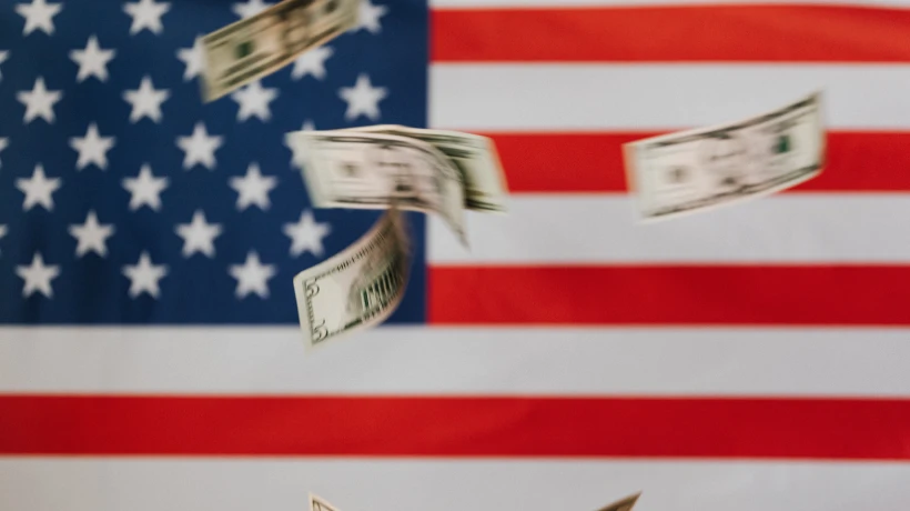 usa flag and dollars flowing