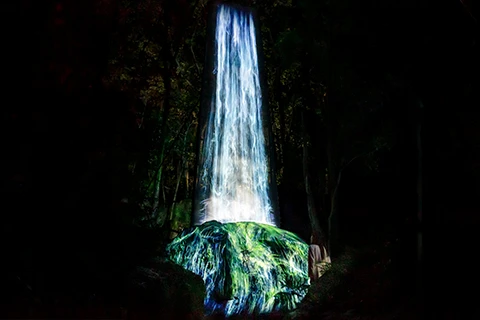 A photo of water particles on a sacred rock